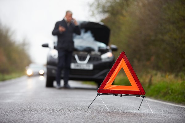 best extended car warranty services autopom! man in black on the phone red car triangle car breakdown   